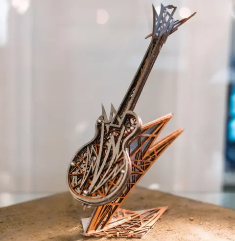 Saskia Blacker A model version of a guitar sculpture