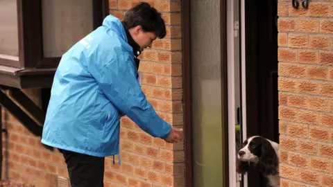ANDY BUCHANAN Ruth Davidson canvassing with dog.