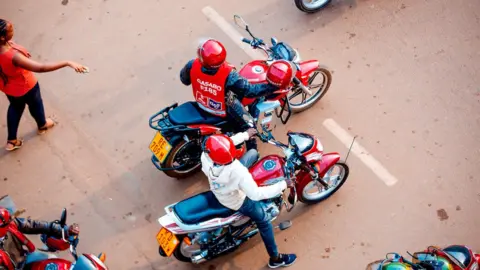 Ampersand Overhead view of motorbike taxis