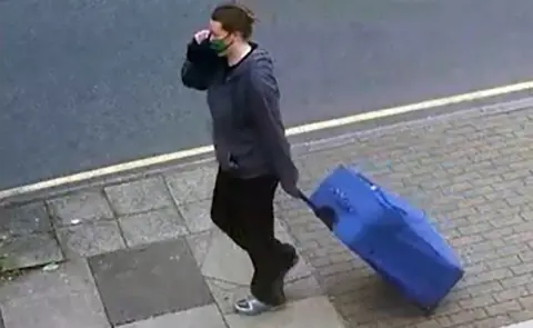 Met Police Mitchell with suitcase