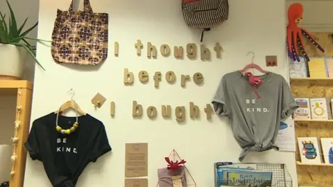 AFP A wall inside the Ripple store which says 'I thought before I bought'