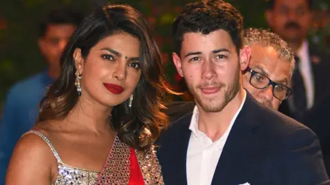 AFP/ Getty Images Priyanka Chopra and Nick Jonas arriving at a party together in June