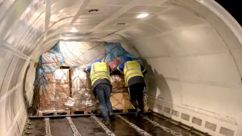 Getty Images Loading a Boeing-737 plane operated by the Volga-Dnepr cargo airline at Vnukovo International Airport