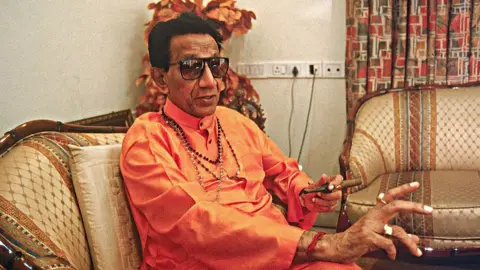 Getty Images Bal Thackeray relaxing with his cigar and explaining ( Shiv Sena, Portrait )