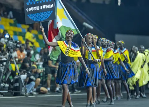 Getty Images A South Sudanese team taking part in the opening ceremony of the Giants of Africa Festival in Kigali, Rwanda - Sunday 13 August 2023
