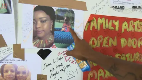 Olu points to an image of Zainab Dean and her son Jeremiah