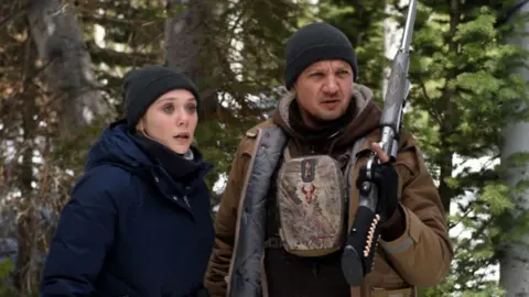 STX Elizabeth Olsen and Jeremy Renner in Wind River