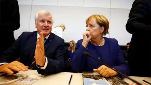 Reuters Bavarian premier and leader of the CSU, Horst Seehofer, with Angela Merkel, 26 September 2017