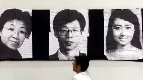 Reuters Black and white pictures of Shao Yunhuan, Xu Xinghu and Zhu Ying at an exhibition in China
