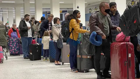 Getty Images Passengers are hoping for no repeat of the long queues seen at airports over the Easter break