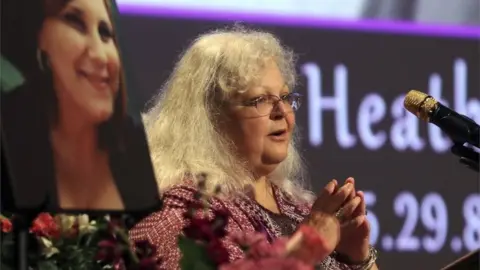 Getty Images Susan Bro, the mother of Charlottesville victim Heather Heyer, speaks at during a memorial for her daughter.