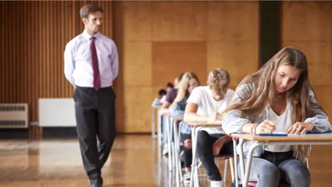 Getty Images Young people taking exams