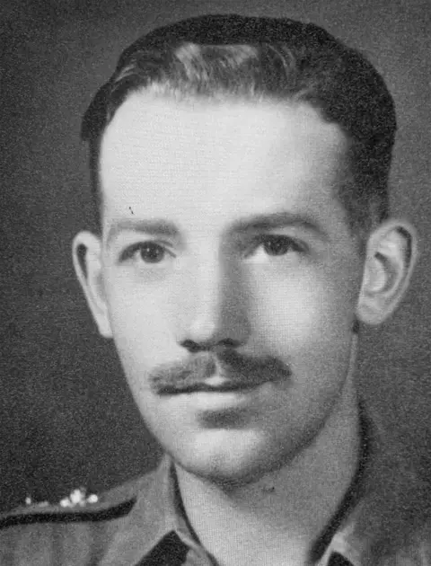 EPA A young Captain Tom Moore poses for a portrait whilst in military uniform