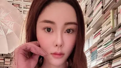 Instagram/Reuters Abby Choi poses