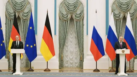 Russian President Vladimir Putin (R) and German Chancellor Olaf Scholz attend a press conference following their meeting over Ukraine security at the Kremlin, in Moscow, on February 15, 2022.