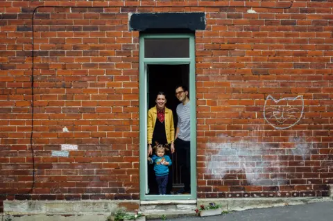 Ellie Grace Photography Doorstep portrait of Grace, Hugh and Ada in Meersbrook