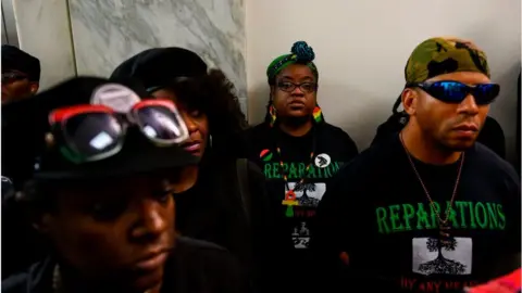 ANDREW CABALLERO-REYNOLDS/AFP/Getty Images Activists stand in line waiting to enter a hearing