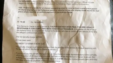 Handout Close-up image of a letter saying "the PCN has not been paid" and "£130 is now due" in capitals