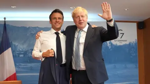 PA Media Macron and Johnson