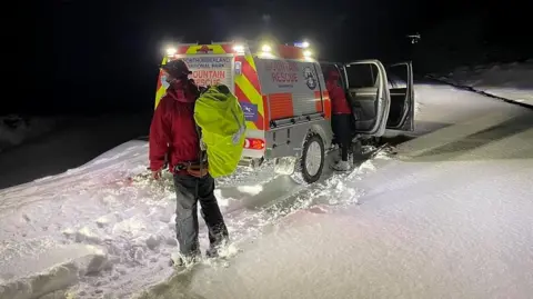 Rescue teams in snow