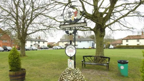 Geograph/Adrian S Pye Shipdham village sign