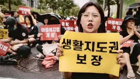 BBC/ Hosu Lee Teacher Kim Jin-seo at a recent protest