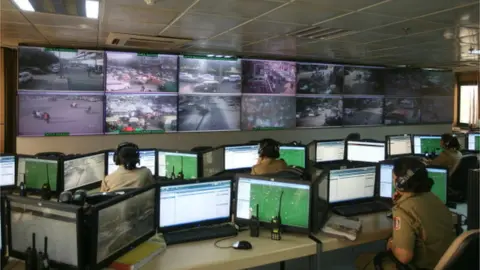 Getty Images Delhi Police C4i control room where more than 1000 CCTV cameras installed in the capital are being monitored.