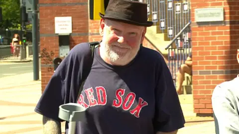 Gregory Palmer smiling as he leaves court