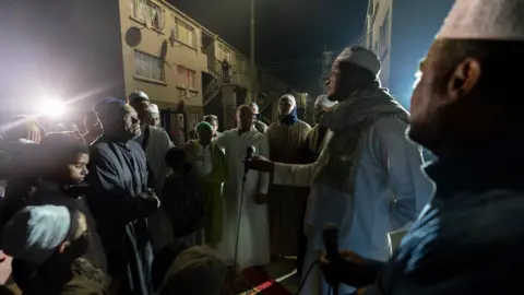 BBC/Shiraaz Mohamed People gathered for dhikr in Manenberg, Cape Town - South Africa