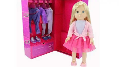 TESCO New Sindy doll in front of a wardrobe