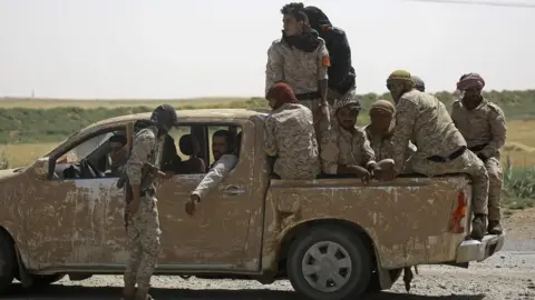 AFP Syrian Democratic Forces (SDF) fighters in the village of Hazima, Syria (6 June 2017)