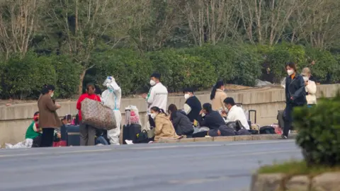 Getty Images Foxconn employees wait to go home