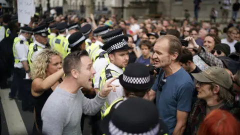 Getty Images Police kept a watchful eye on protesters as arguments broke out in Westminster