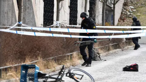 AFP The police has cordoned off and investigates the area outside Varby Gard metro station south of Stockholm where two people were injured in an explosion on January 7, 2018.