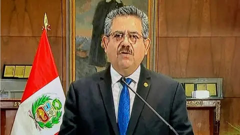 Getty Images A TV grab taken as Manuel Merino announces his resignation in a televised message from the Government Palace, on 15 November 2020