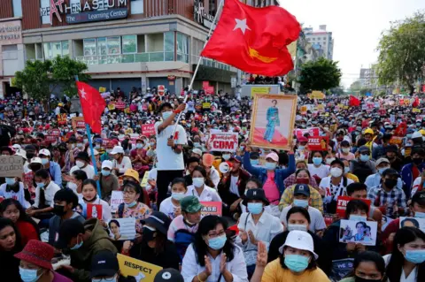 Getty Images Myanmar protesters take part in a demonstration against the military coup near Sule Pagoda in central Yangon, Myanmar on February 17, 2021.