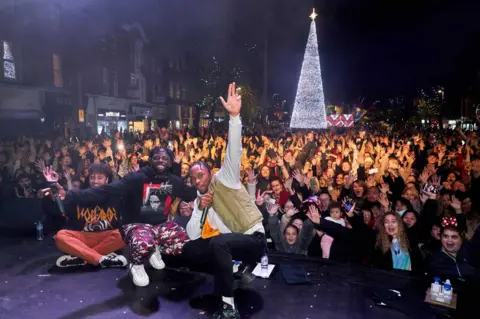 Simon Jacobs Rak-Su switch on Watford's Christmas lights in 2021