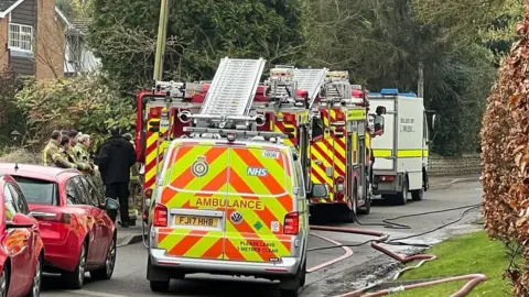 Steve Hubbard/BBC Emergency services at scene