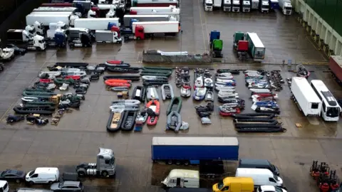 PA Media Boats held in storage in Dover after being used to cross the Channel