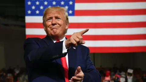 AFP US President Donald Trump walks off stage after a "Keep America Great" campaign rally at the SNHU Arena in Manchester, New Hampshire, on August 15, 2019.