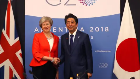 Reuters Theresa May and Shinzo Abe