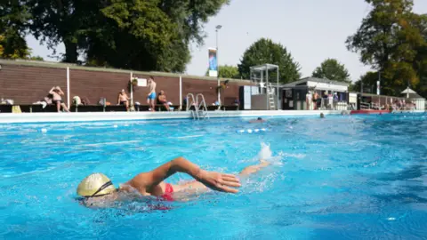 PA Media People swimming in Jesus Green Lido in Cambridge