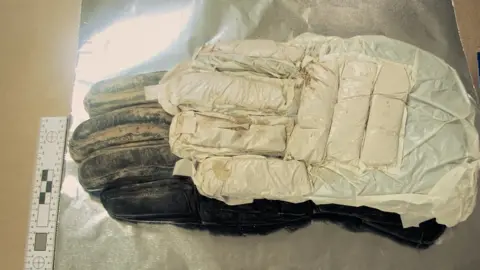 National Crime Agency Glove with concealed drugs