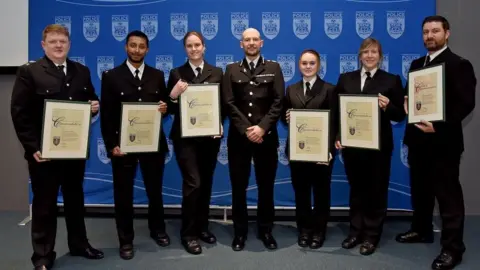 Thames Valley Police police officers holding certificates