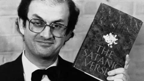 PA Media File photo dated 14/02/89 of Sir Salman Rushdie, author of "The Satanic Verses"