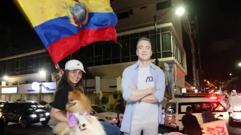 EPA A supporter of the presidential candidate Daniel Noboa celebrate the victory of their candidate during the 2023 presidential elections in Guayaquil, Ecuador, 15 October 2023.