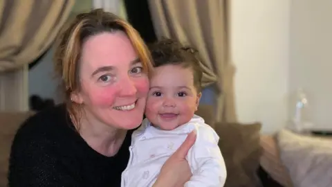 Family photo Cathryn McShane-Kouyaté and her grandchild