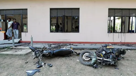 Reuters Muslim men react after an attack in Kiniyama