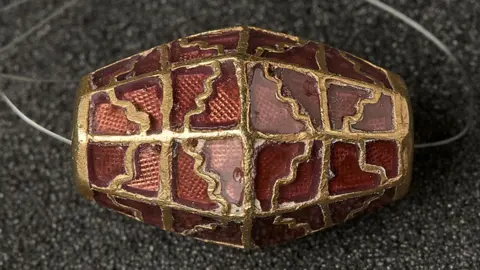 Suffolk County Council Gold and garnet bead