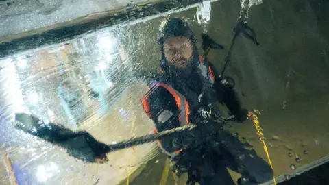 Man cleaning glass